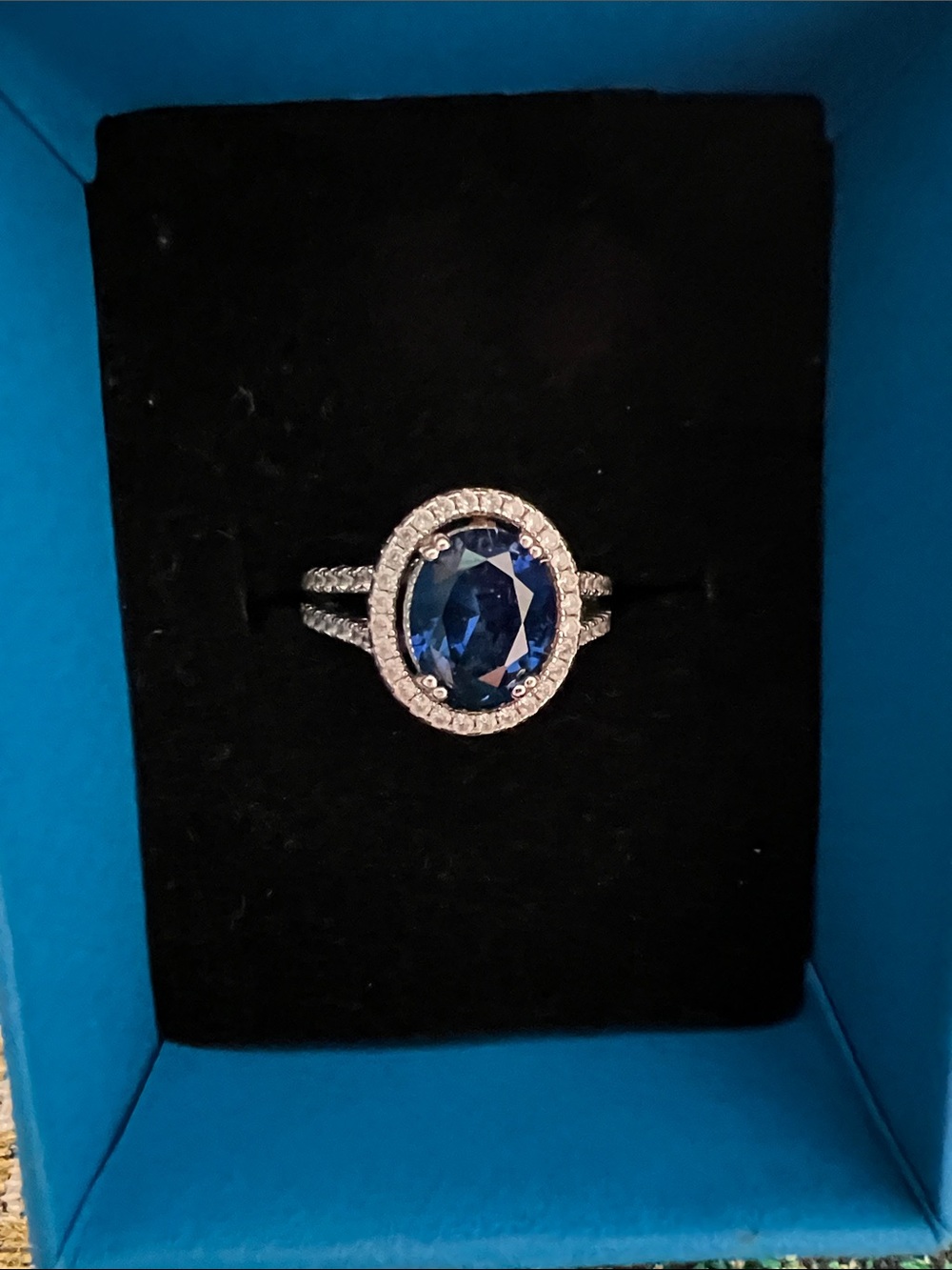 JTV Blue Oval Sapphire Halo Ring with Pavé Split Shank